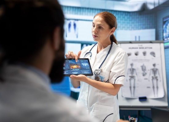 doctor-neurologist-showing-mri-brain-scan-results-her-colleagues (1)
